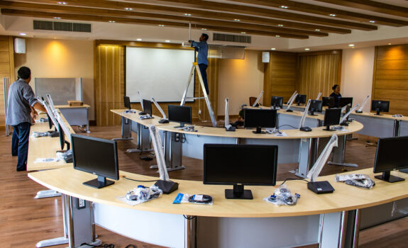 Nakhon Pathom Province, Thailand - September 12, 2017 : The technicians are installing and testing new electronic audiovisual equipment and new black monitors in the auditorium or meeting room